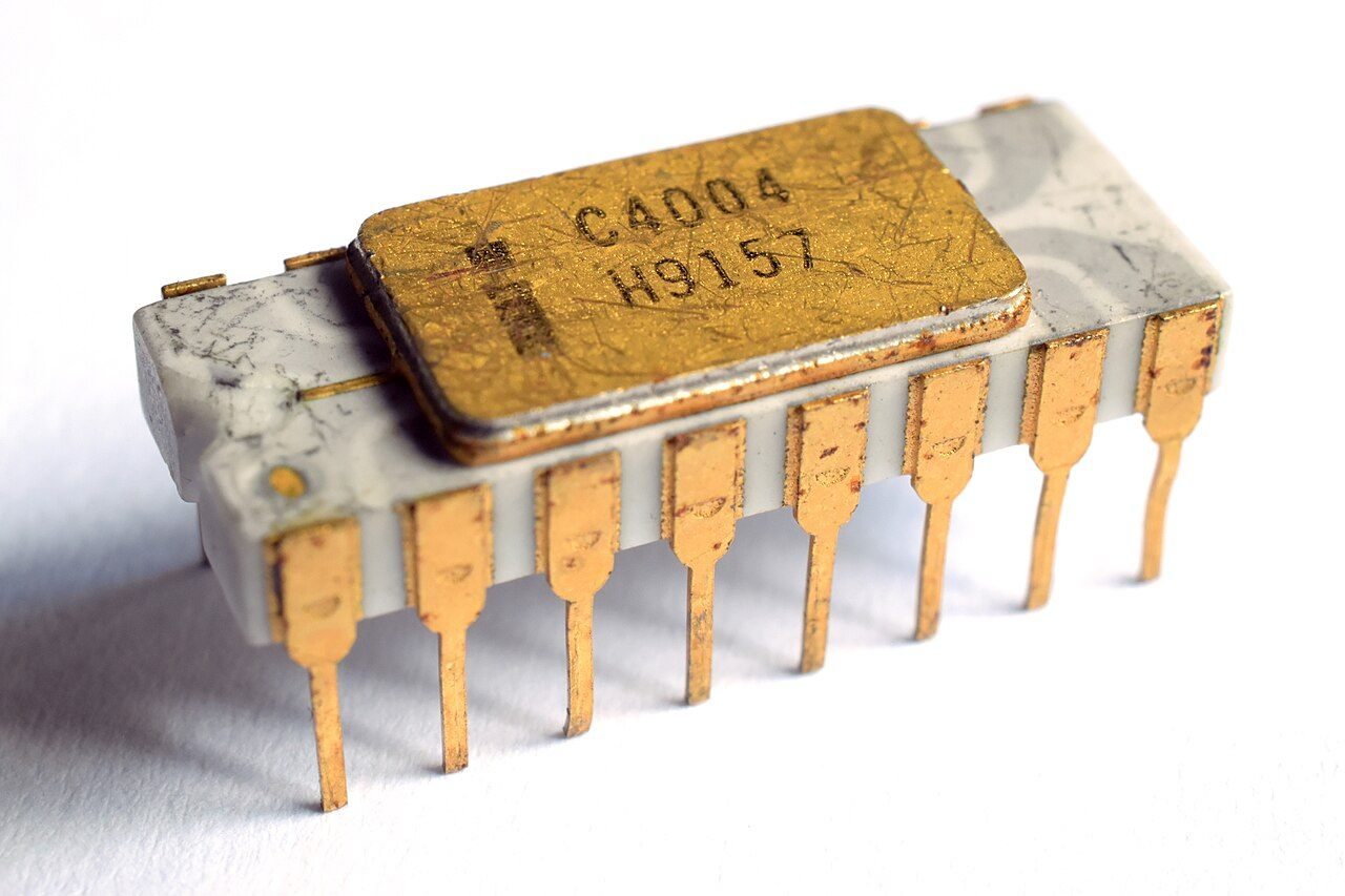 A small white and gold chip marked C4004 with gold pins