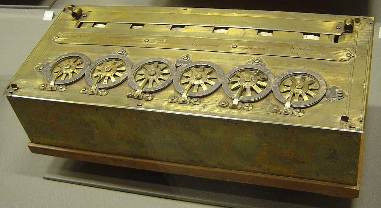 A brass box with a row of number wheels on top: Pascal's calculator