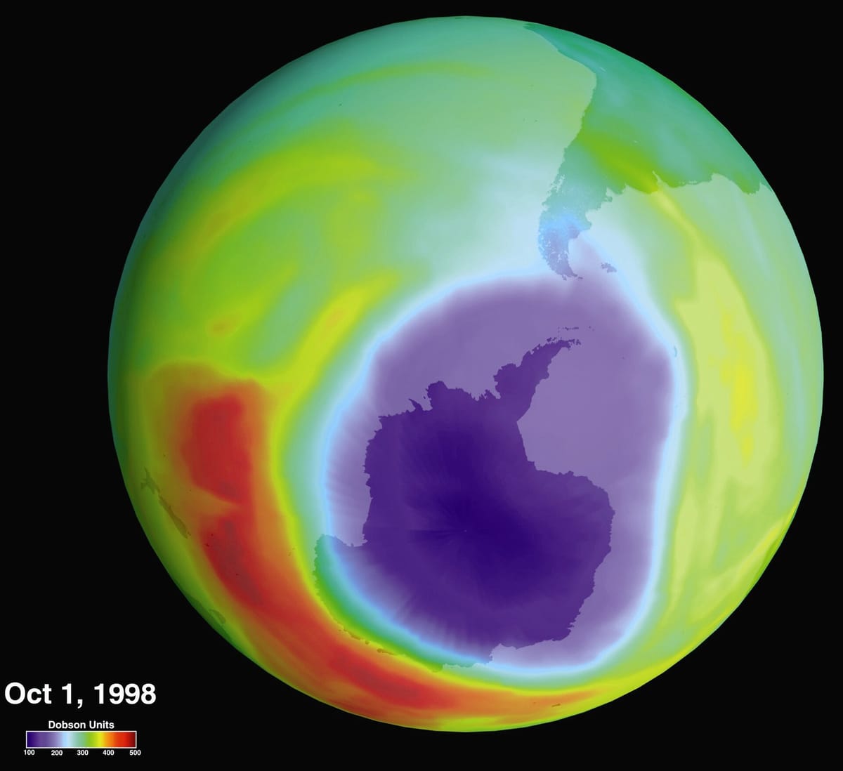 NASA satellite map of the globe from below, with a large purple patch of low ozone over Antarctica, dated 1 October 1998