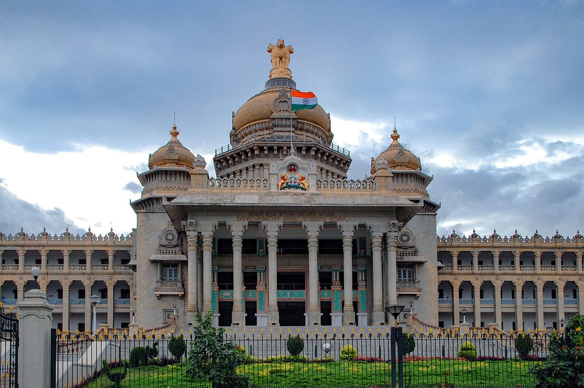 The white stone Vidhana Soudha building in Bengaluru with a central dome and wide steps