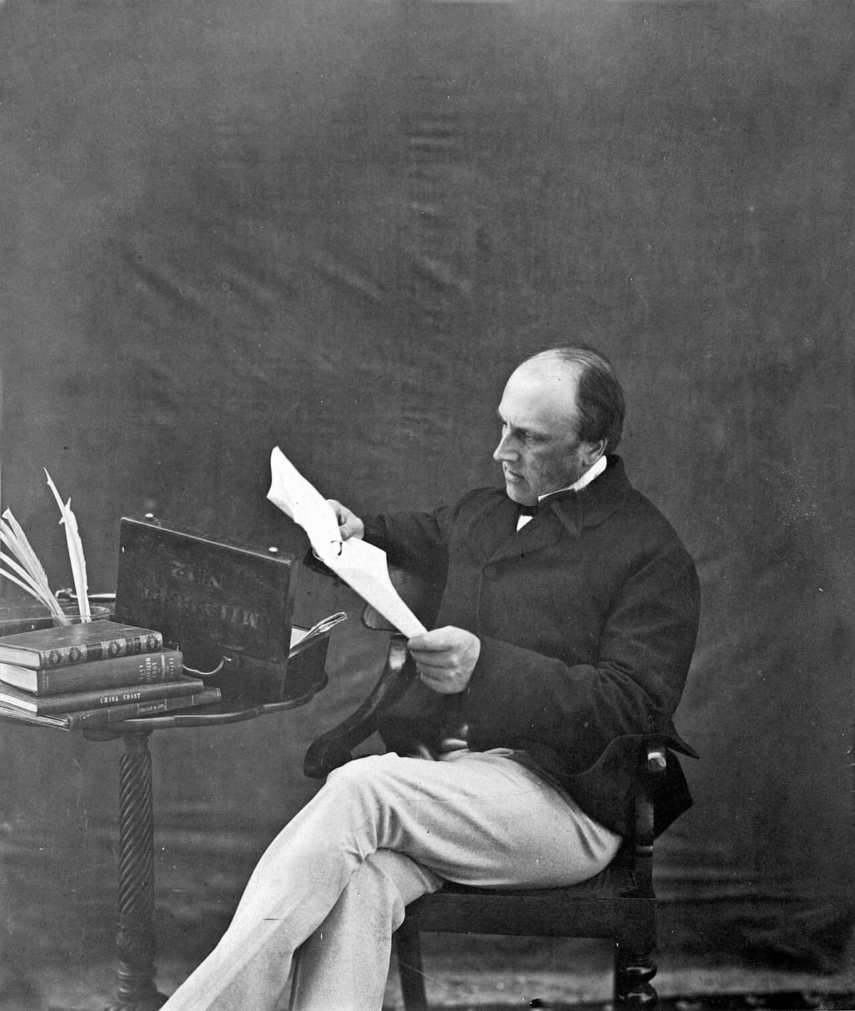 Old studio photograph of Lord Canning seated, in a dark coat