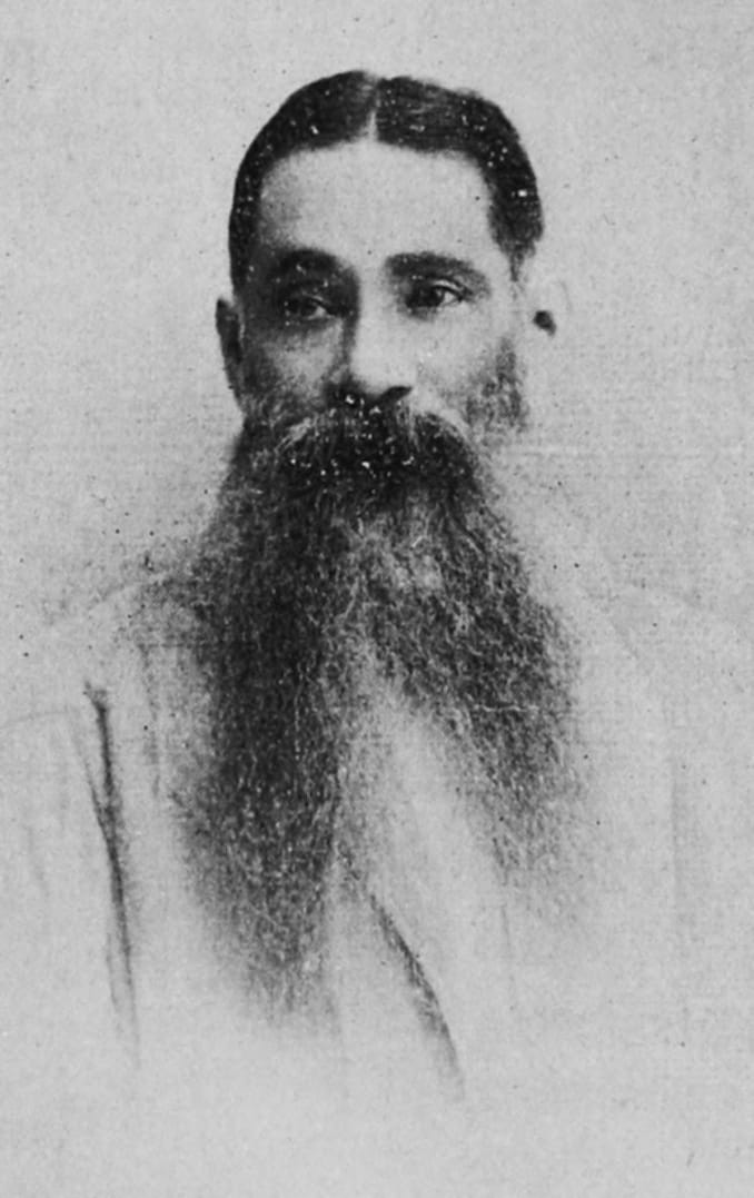 Old portrait photograph of W. C. Bonnerjee in a dark suit