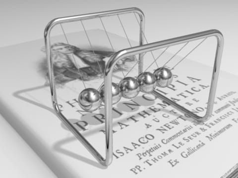 Computer-made picture of five shiny steel balls hanging in a row from thin strings on a frame, resting on an old book