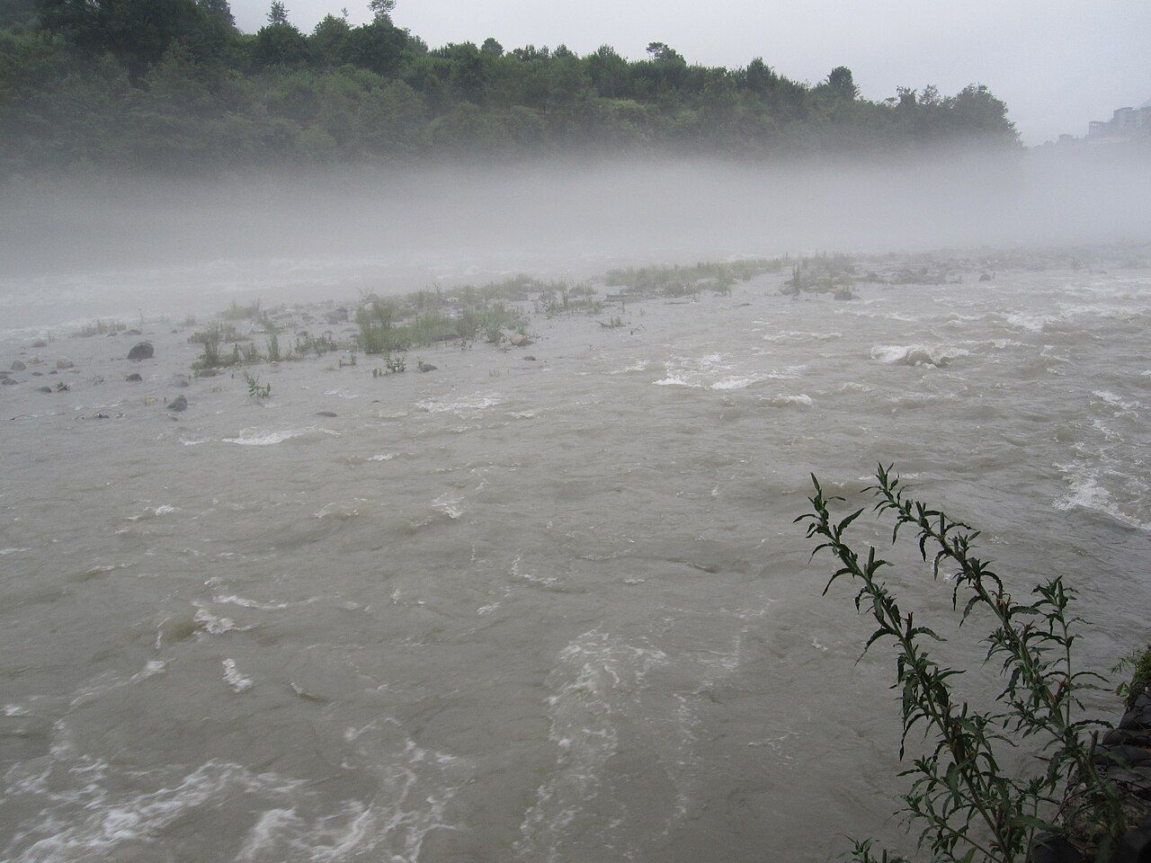 The Beas rushing over stones in the Kullu valley, with mist over the water