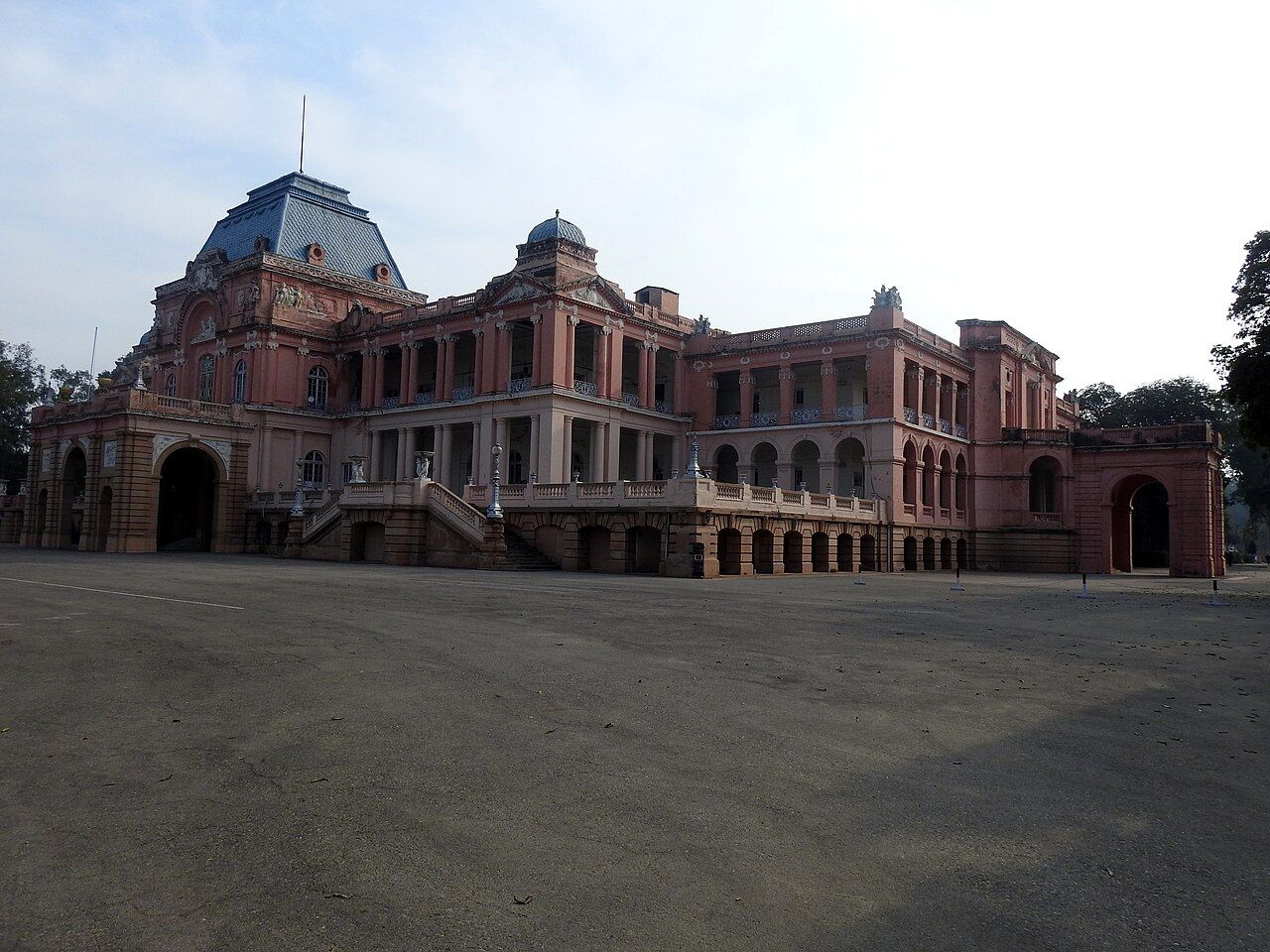 A large pink palace with French-style roofs in Kapurthala