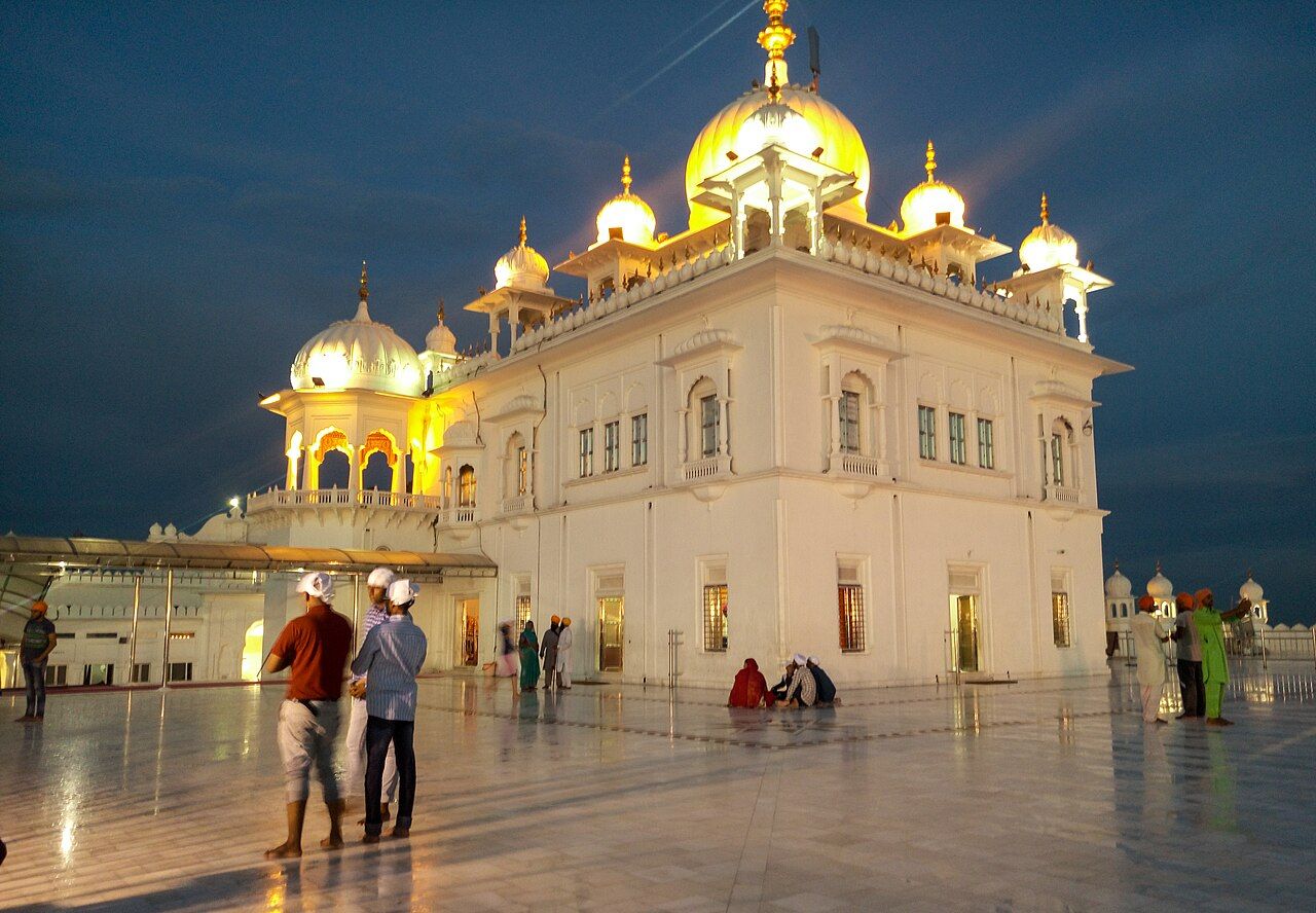 White marble Takht Sri Kesgarh Sahib lit up at dusk, Anandpur Sahib