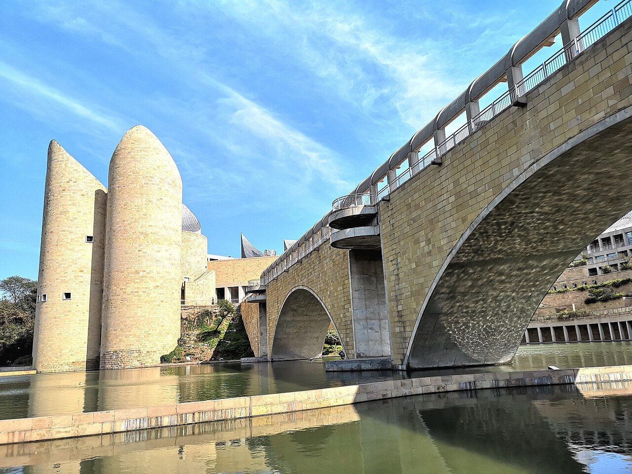 Sandstone towers and a bridge over water at Virasat-e-Khalsa, Anandpur Sahib