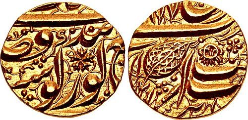 Both faces of a gold-coloured coin of Maharaja Ranjit Singh with Persian writing and a leaf mark