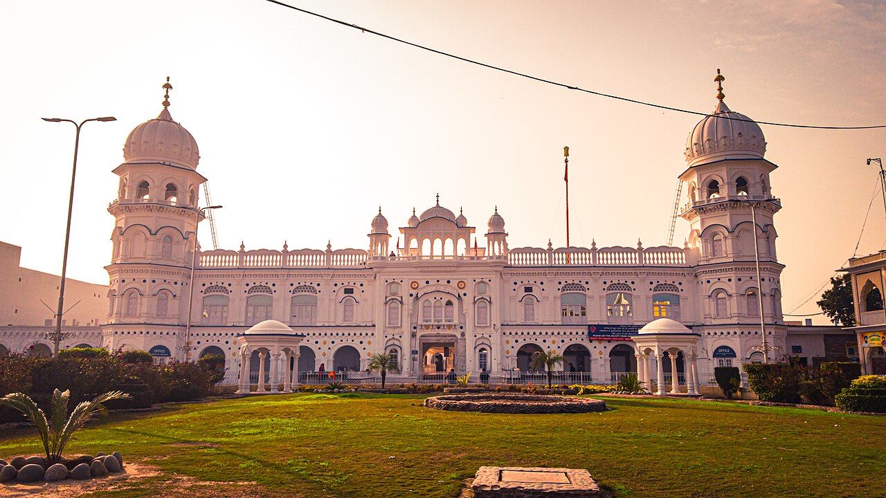 Pink-domed Gurdwara Janam Asthan with lawns in front, Nankana Sahib