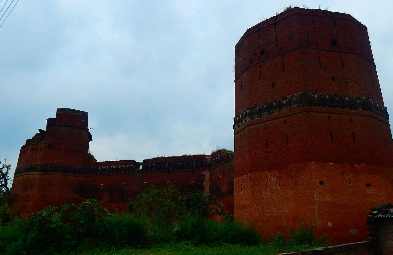 Tall round brick bastion and walls of Bajwara Fort, Hoshiarpur