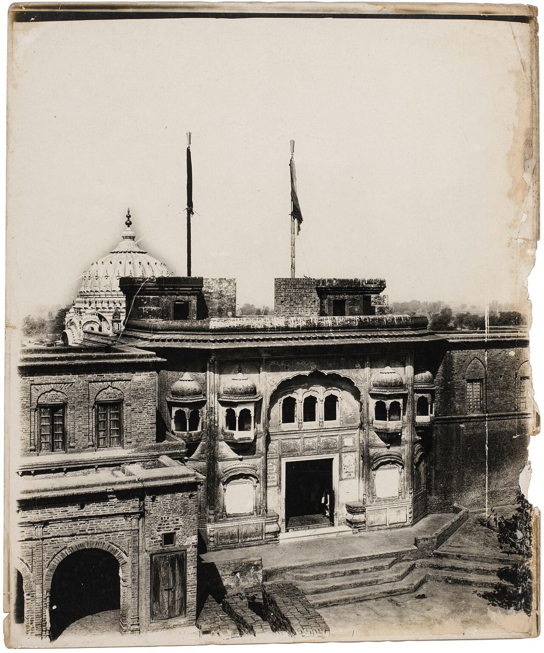 Old photograph of the gateway and dome of the gurdwara at Khadur Sahib