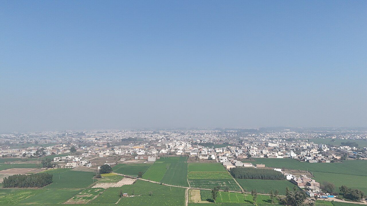 Aerial view of Said Kheri village near Rajpura: houses ringed by green fields