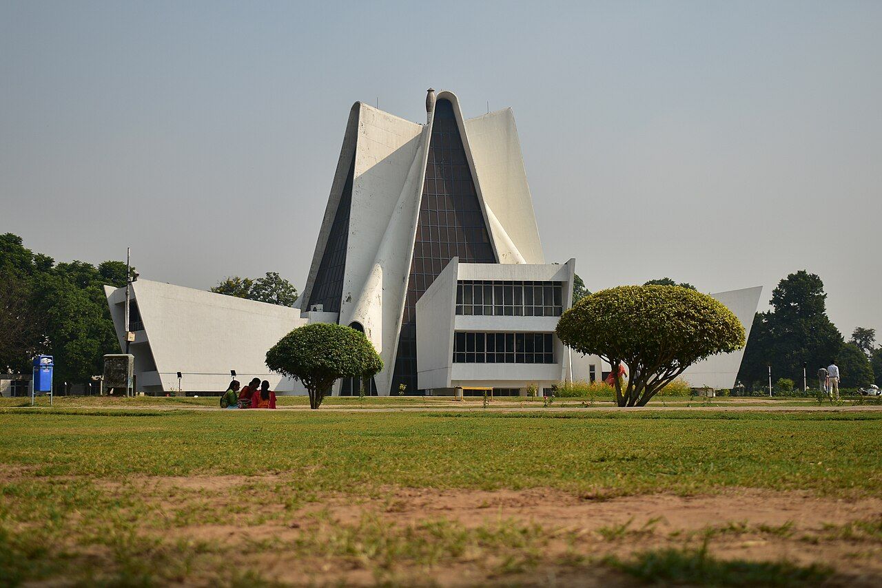 A white, tent-shaped modern building on the Punjabi University campus, Patiala