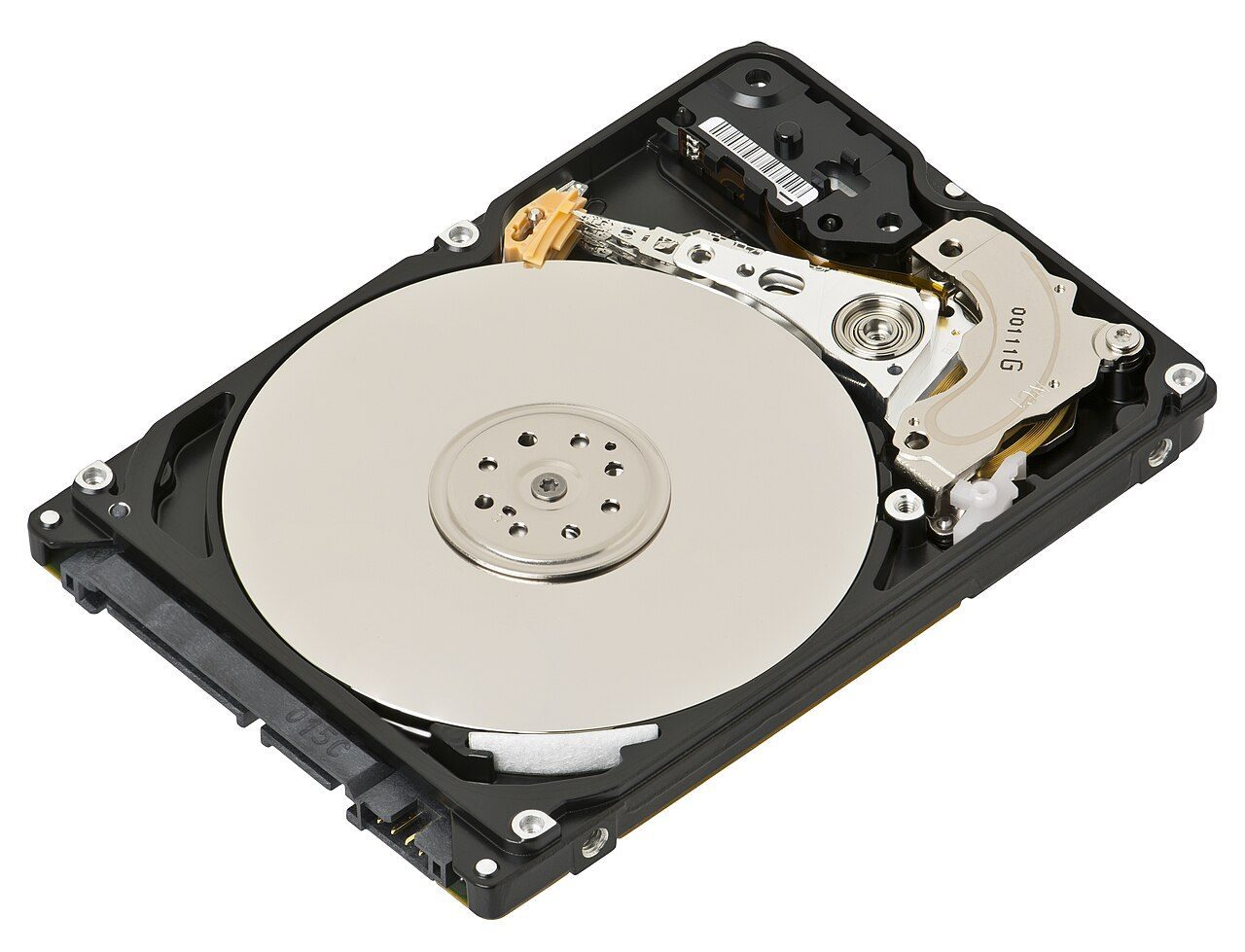 An opened laptop hard drive showing a shiny round platter and the arm with the read-write head over it