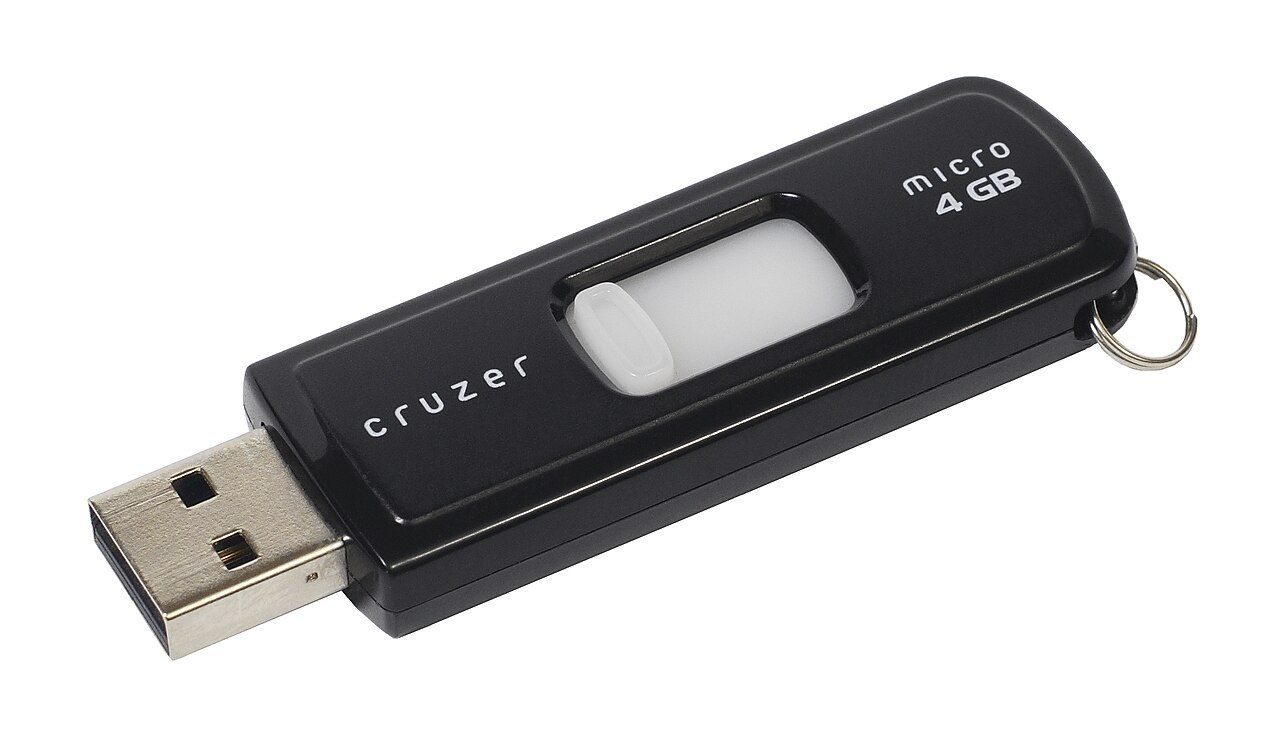 A small USB pen drive with its cap off