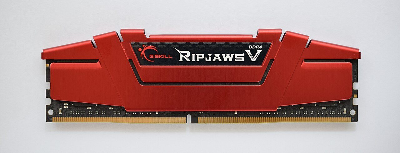 A long green RAM stick with black memory chips in a row and gold contacts along the bottom edge